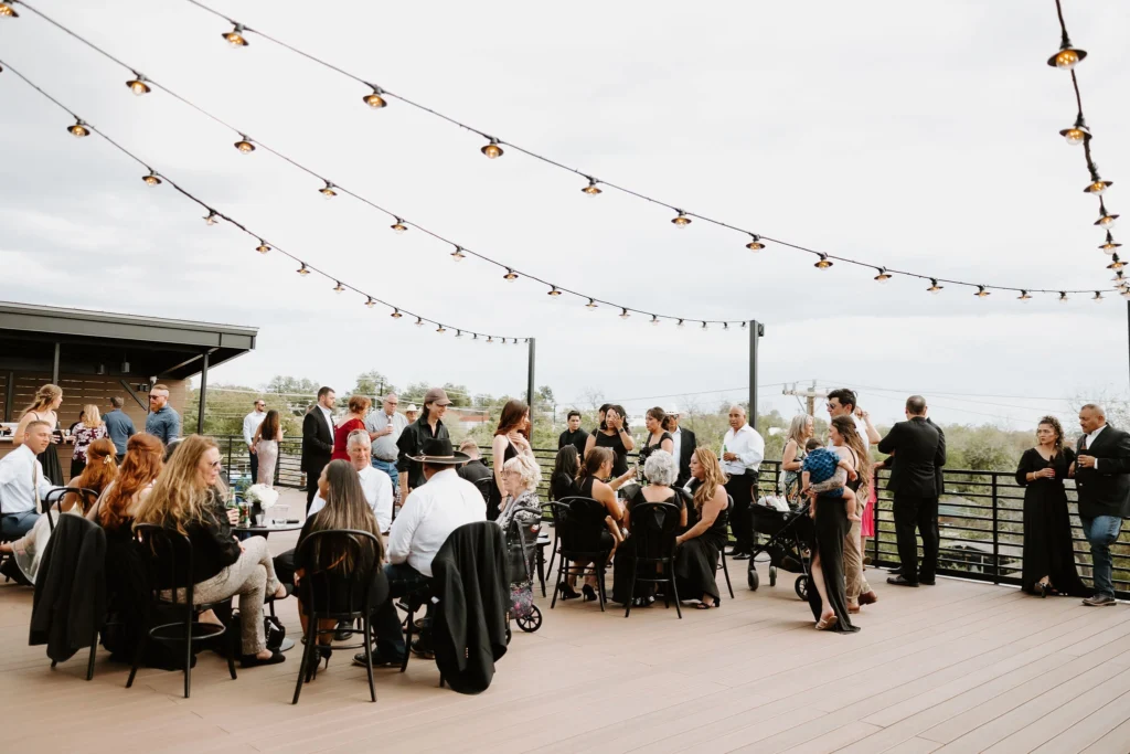 Guests mingle outside. on the outside deck space at the Skyline San Antonio