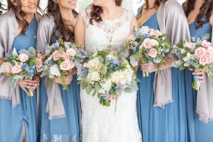 A bride and her bridesmaids hold their bouquets