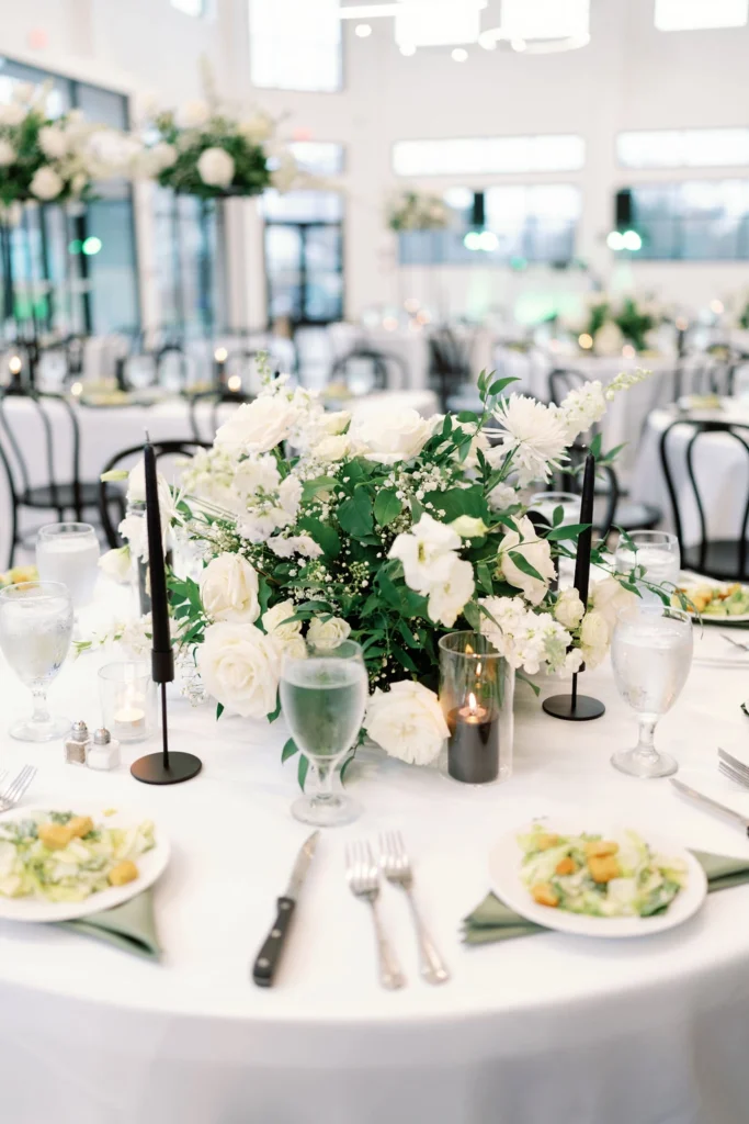 Floral arrangements and salads adorn the event space inside the Skyline